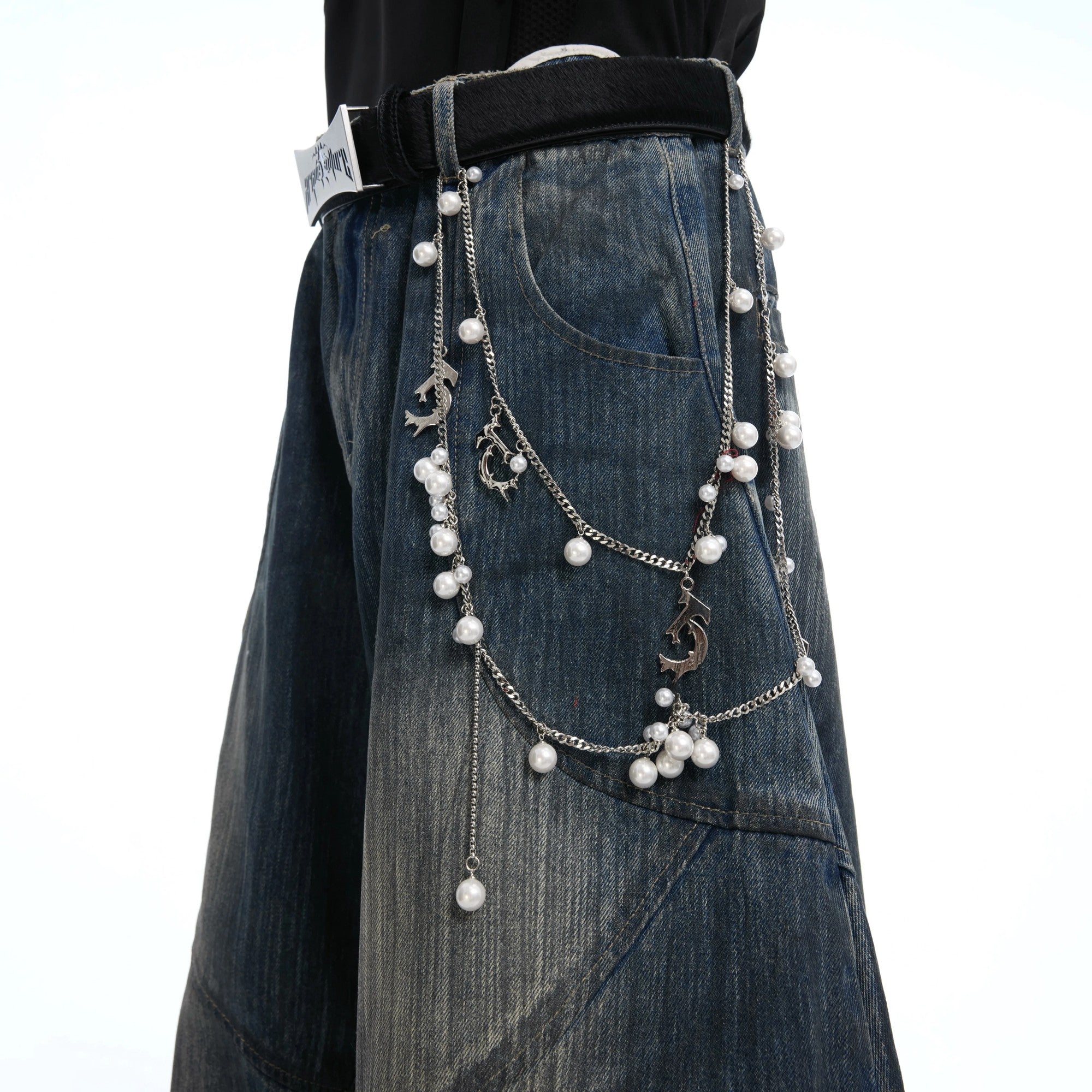 Back view of loose straight fit distressed jeans showing texture