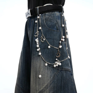 Back view of loose straight fit distressed jeans showing texture