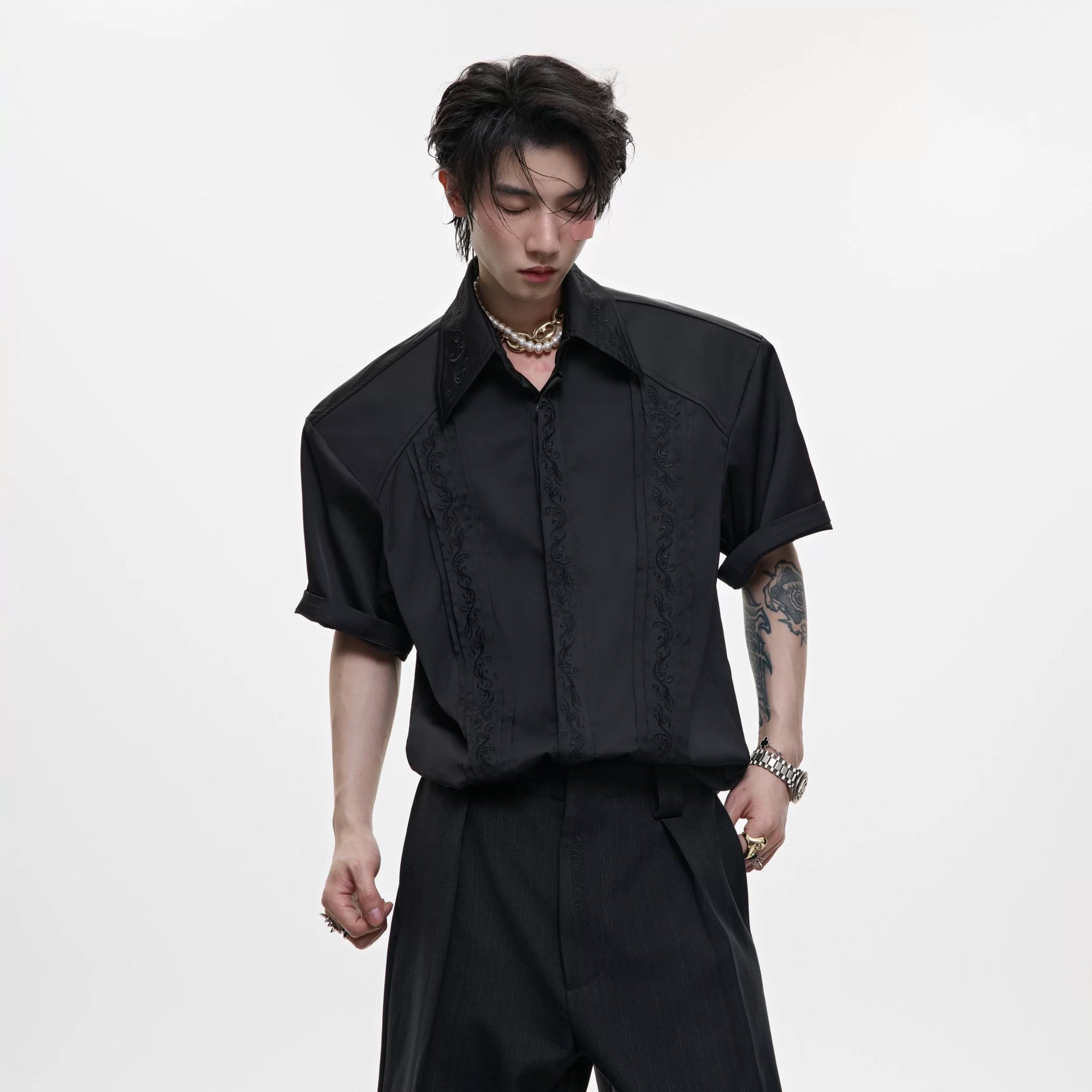 Front view of black luxury embroidered short sleeve shirt