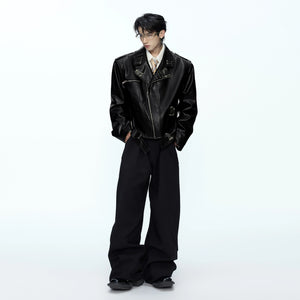 Model wearing a cropped boxy leather jacket in a streetwear setting