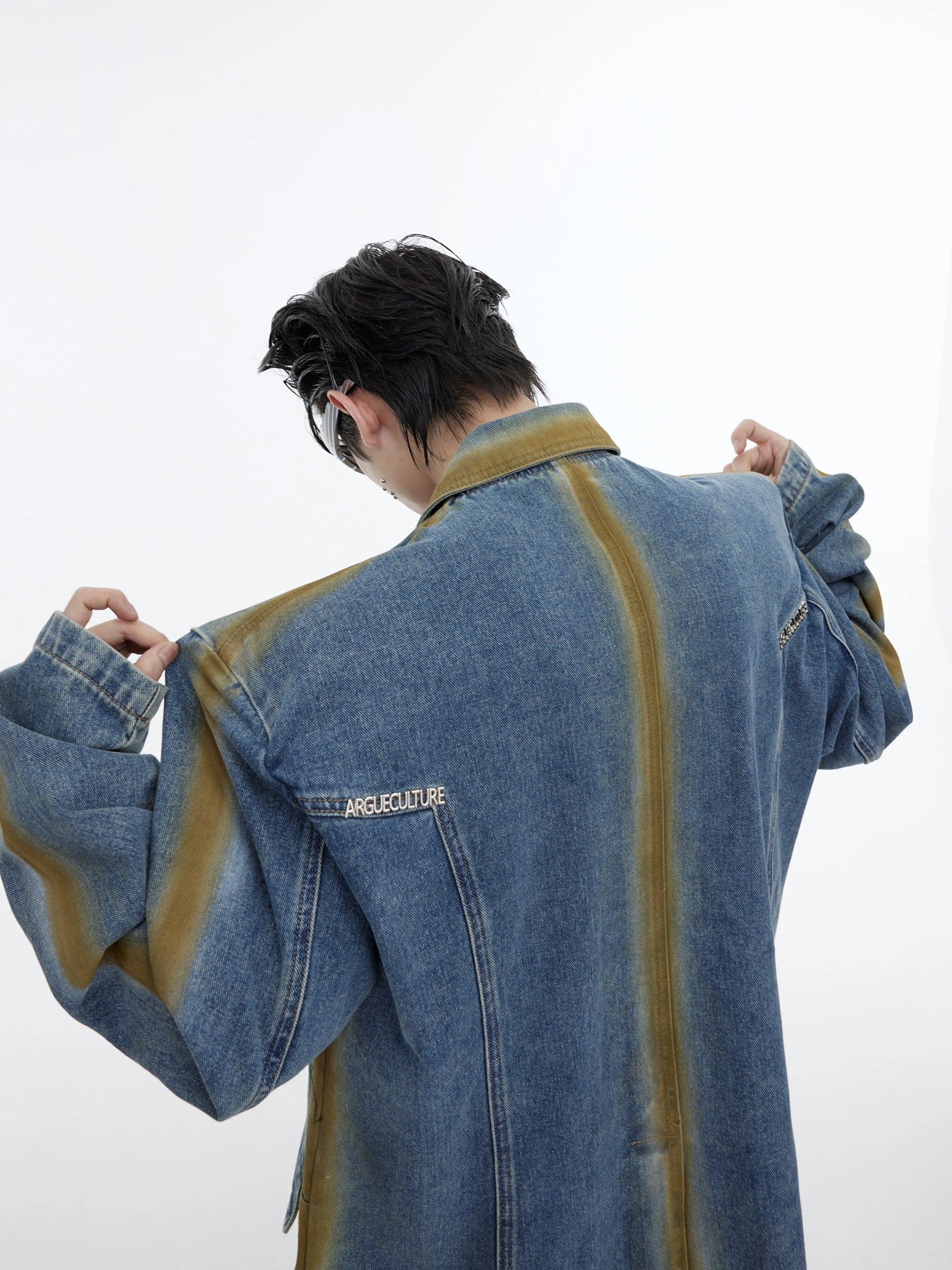 Close up of the padded shoulder and double breasted closure