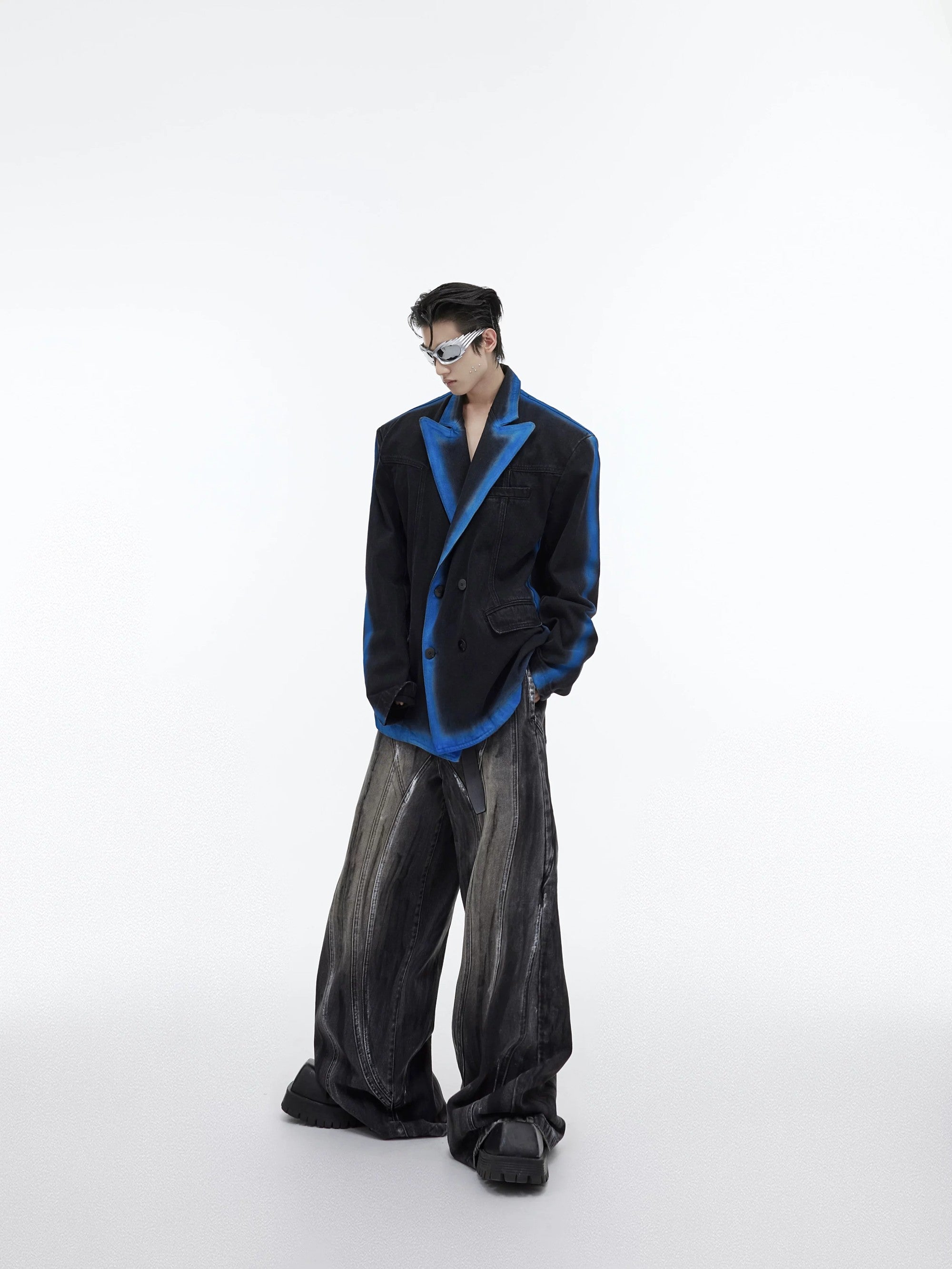 Model wearing blue gradient denim blazer in a streetwear setting