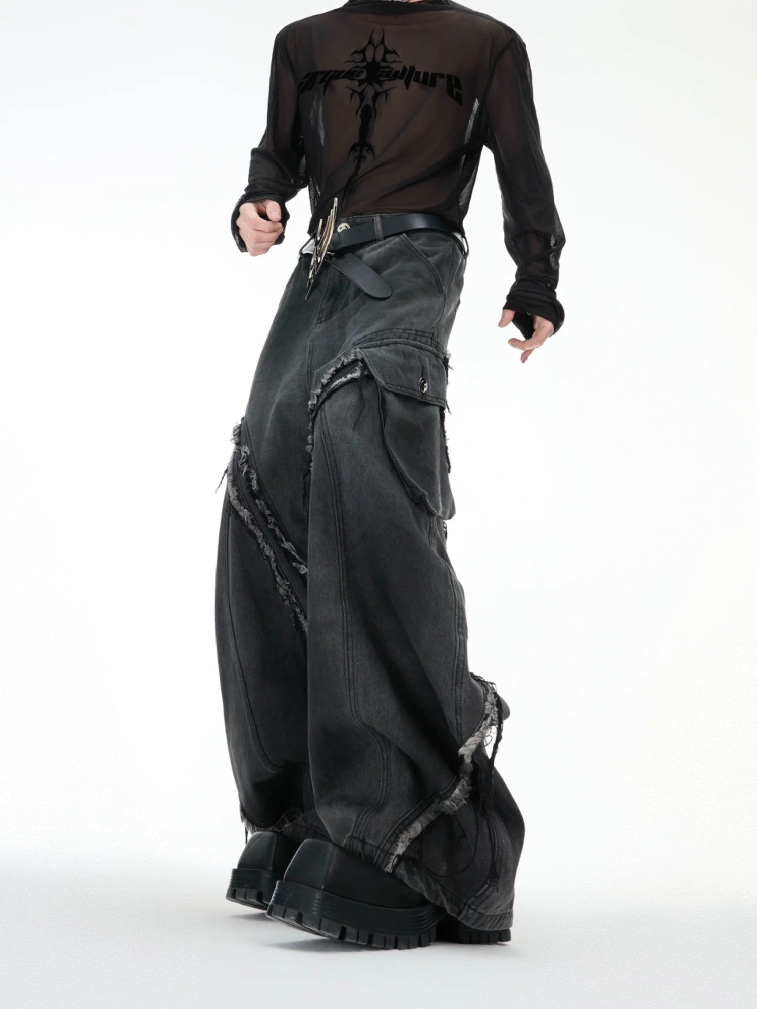 Back view of loose fit streetwear jeans showing embroidery and fringe details