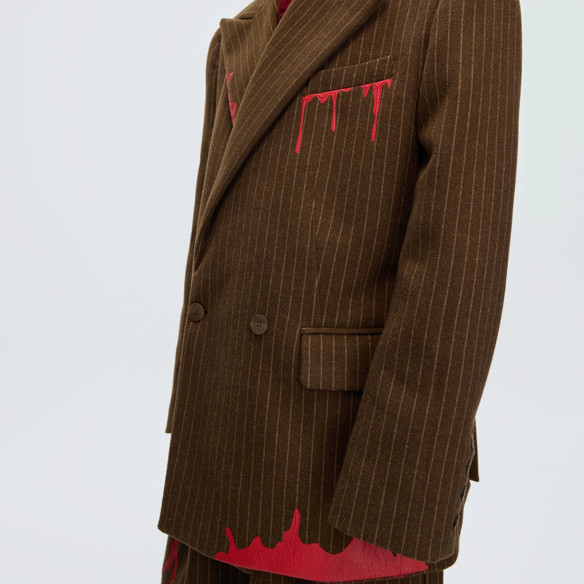Back view of the striped wool blazer showing double vent design