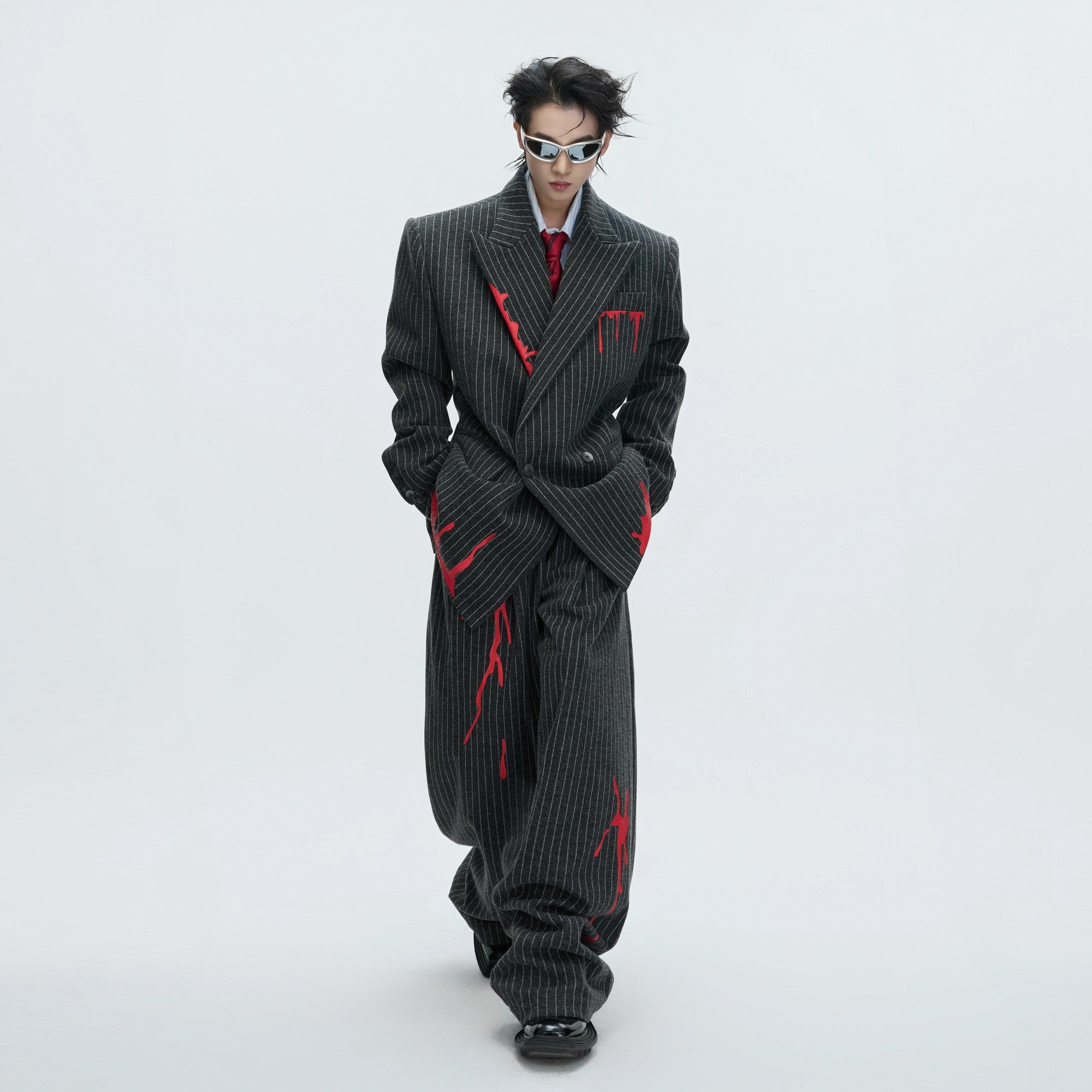Matching brown striped wool pants in a loose streetwear fit