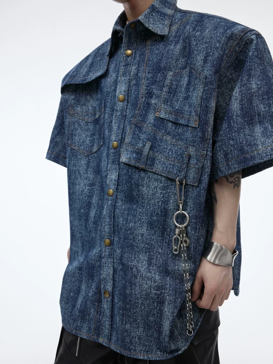 Close up of deconstructed stitching and metal hardware on polo shirt