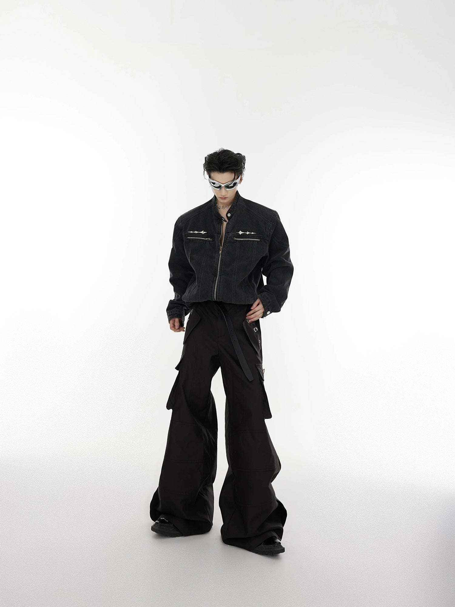 Close up shot of the metal spike hardware on the denim jacket chest