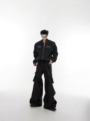 Close up shot of the metal spike hardware on the denim jacket chest