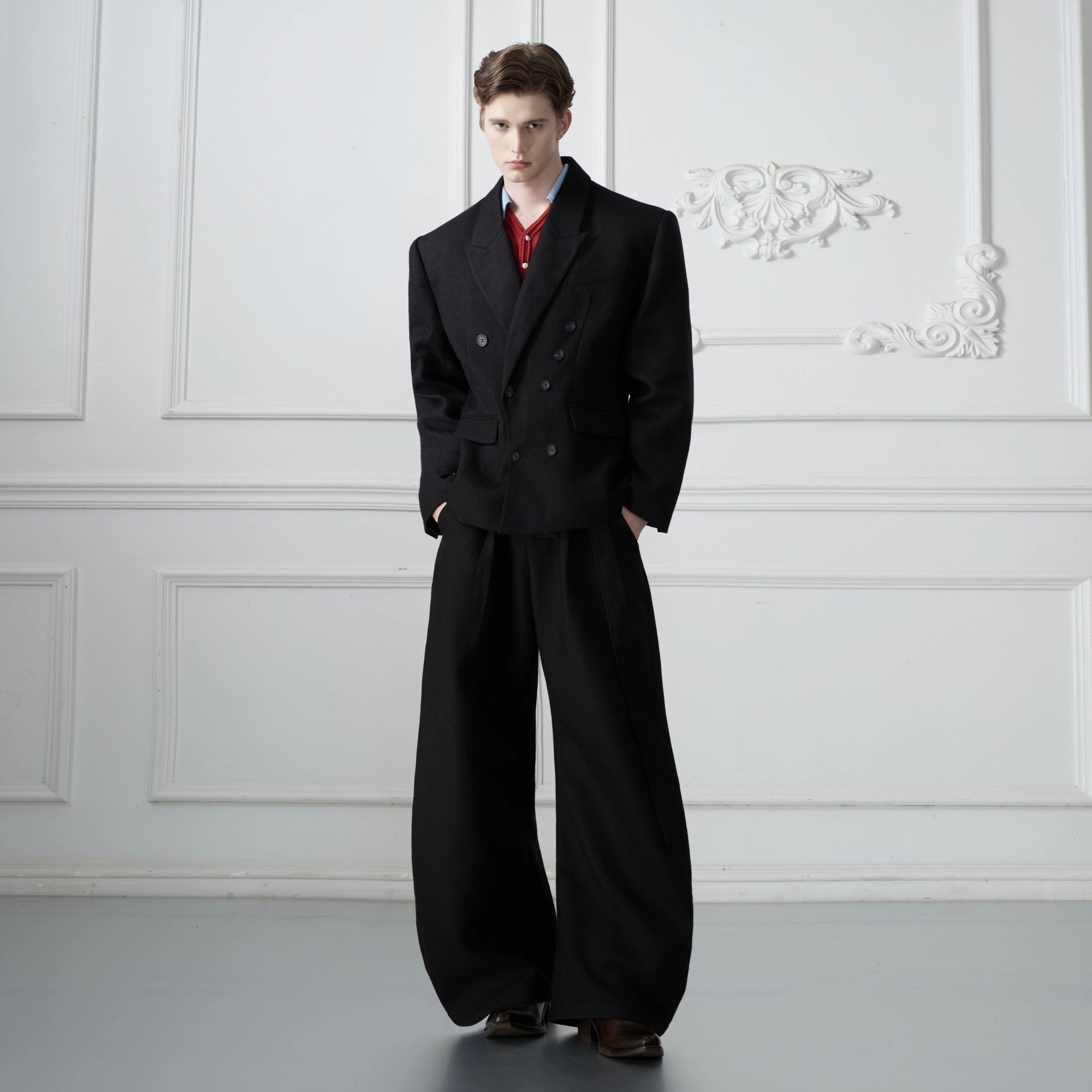 Model wearing white waffle texture streetwear suit at a party