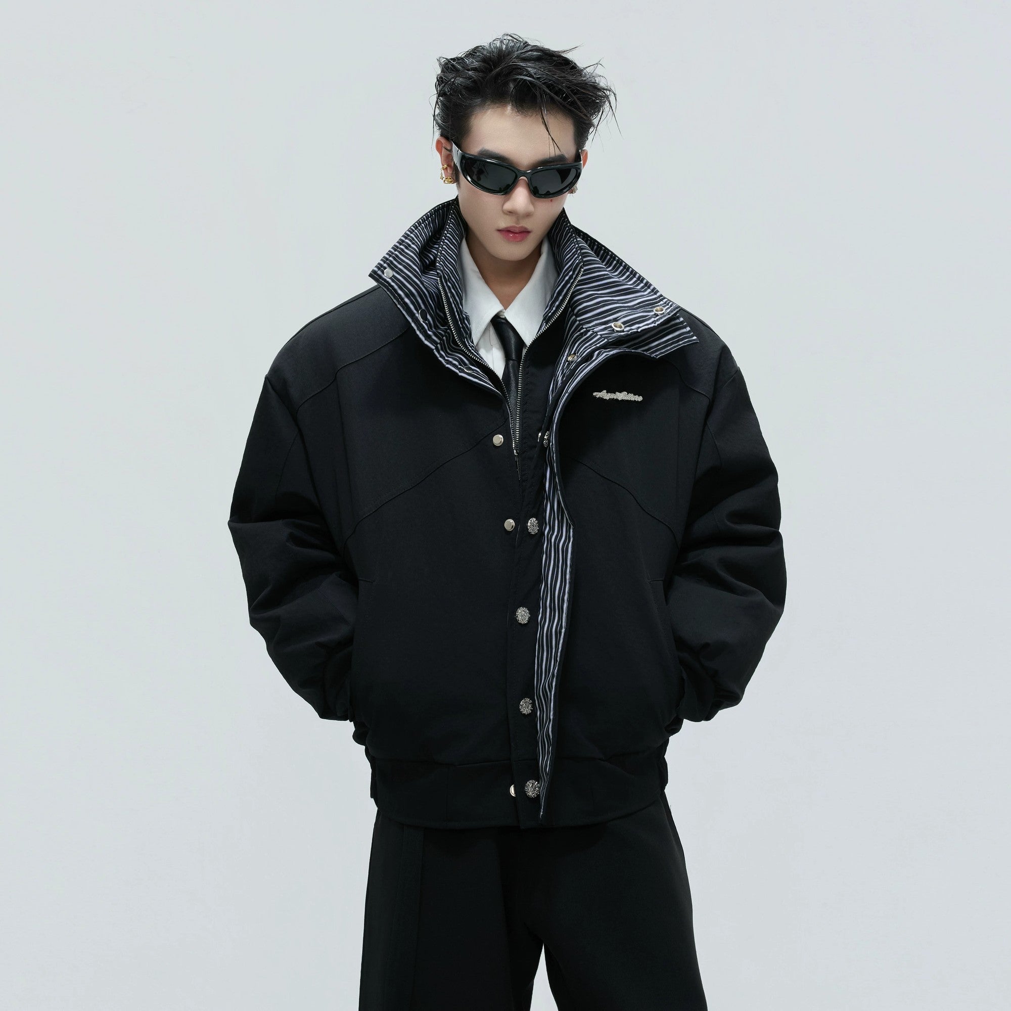 Front view of the washed stripe fake two-piece padded jacket in black