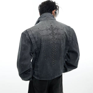 Front view of a vintage washed denim jacket with metal rivets