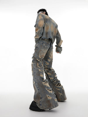 Back view of the micro-flare distressed denim pants showing fit and silhouette