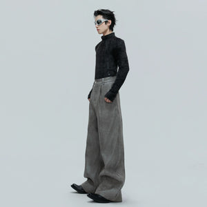 Back view of baggy curved pants showing the unique leg silhouette