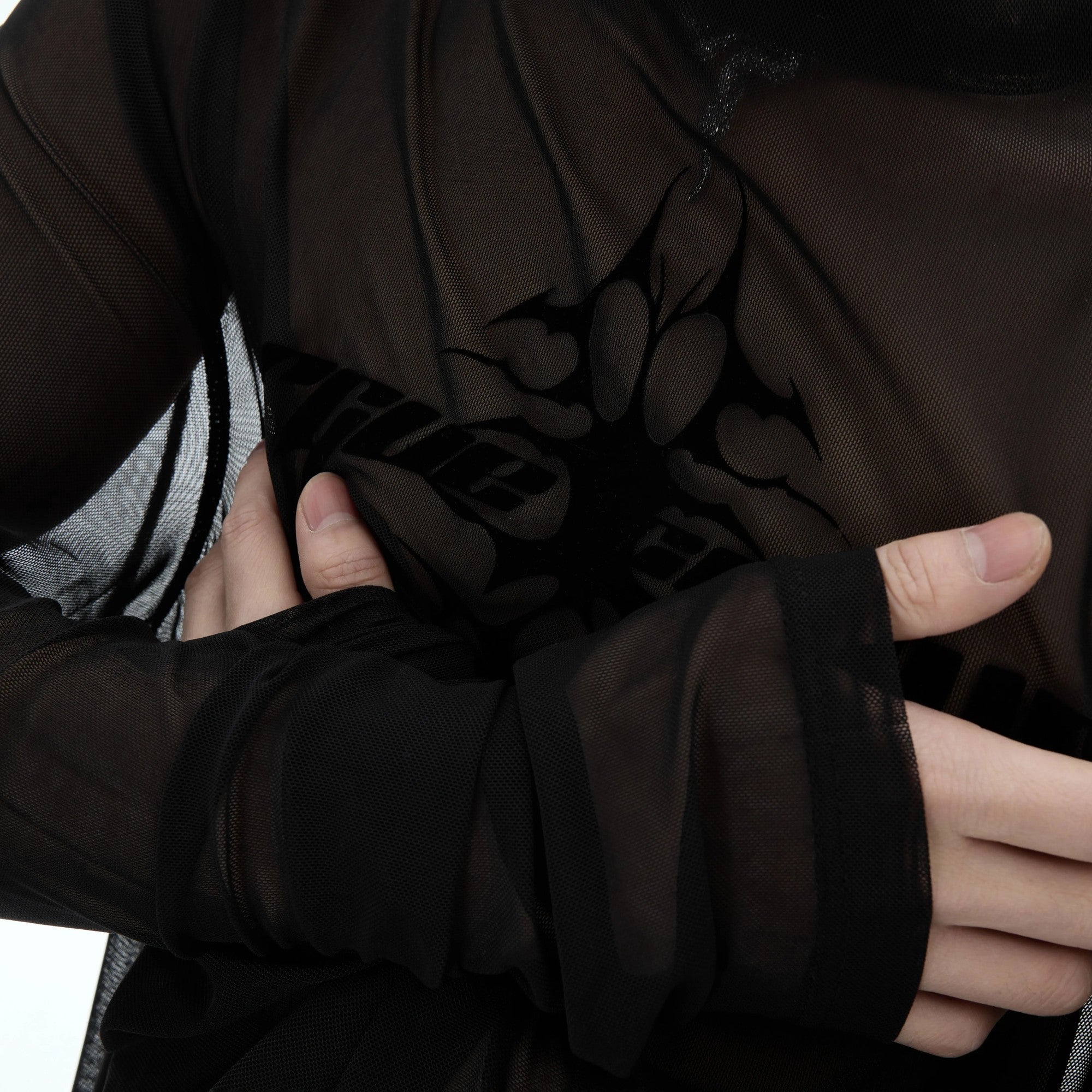 Model wearing the punk mesh tee in a street style setting